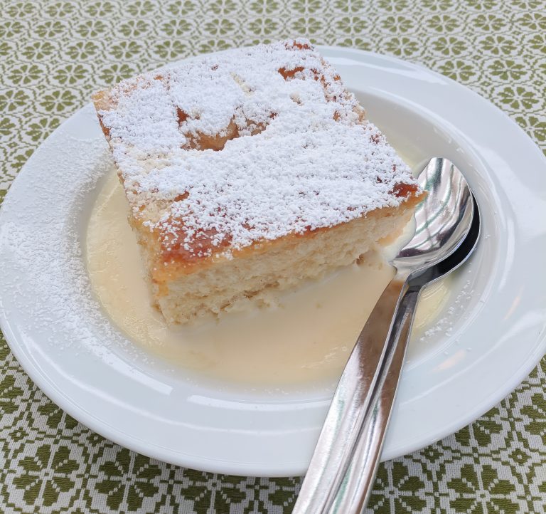 dampfnudel on a plate on a green and white table cloth