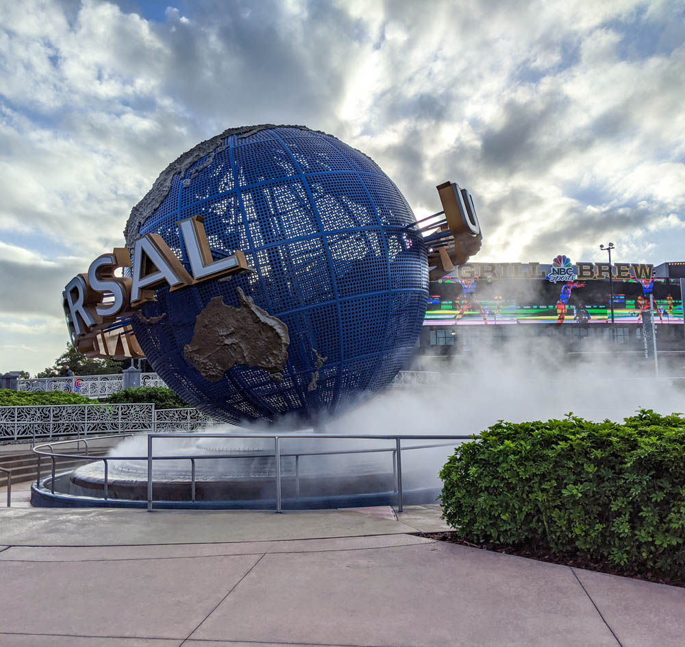 giant Universal Studios globe surrounded by mist - things to do in orlando besides theme parks