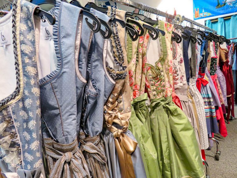 racks of beautiful dirndls in a trachten pop up shop in munich during oktoberfest