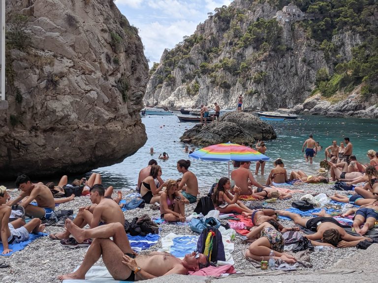 tiny beach packed with people