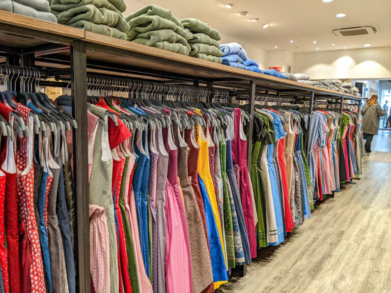 Racks of colorful dirndls at a shop in Munich